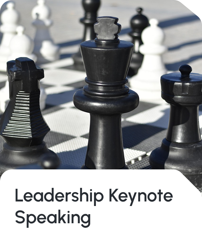 Strategic leadership marketing image featuring chess pieces including a prominent black king piece in sharp focus with blurred pawns and white pieces in the background, combined with the text 'Leadership Keynote Speaking'. Represents Star Trak Investments LLC and Angel Mary's executive thought leadership, professional speaking engagements, and strategic business guidance on organizational leadership and investment strategy