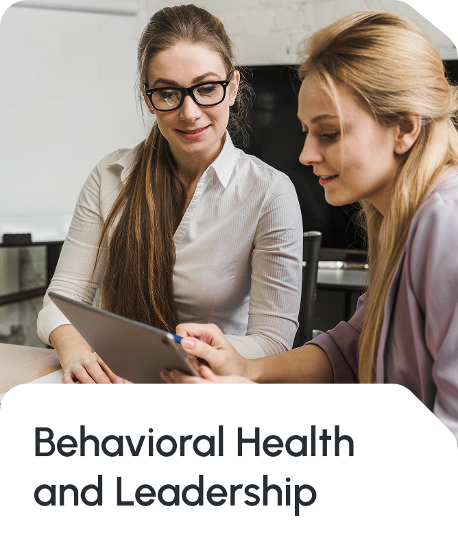 Professional marketing image featuring two businesswomen in an office setting with the text 'Behavioral Health and Leadership' prominently displayed, representing Star Trak Investments LLC's focus on executive wellness, organizational behavioral health, leadership development, and employee well-being programs integrated with financial planning and wealth management services